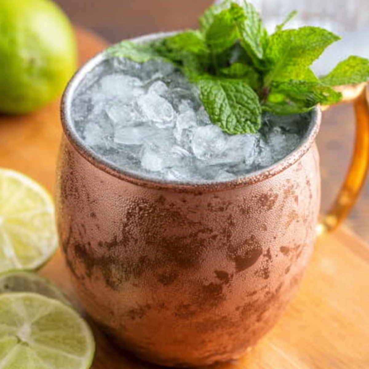 Moscow Mule Recipe Classic Moscow Mule cocktail served in a copper mug with crushed ice, fresh mint, and lime slices.