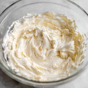 Tiramisu Brownies Recipe | Easy 3-Layer Dessert 16 Whipped mascarpone cream in a glass bowl, light and fluffy texture ready for tiramisu brownies