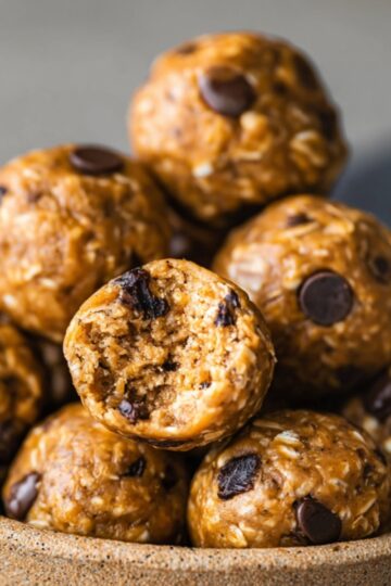 Energy Ball Recipe | No-Bake Snack Ready in 10 Minutes 20 energy ball Recipe No-bake peanut butter energy balls piled in a rustic ceramic bowl with oats and chocolate chips, healthy homemade snack