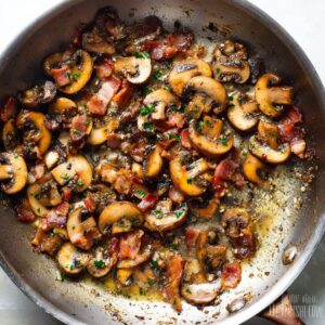 Creamy Mushroom Chicken Recipe 15 Sautéed mushrooms and crispy bacon cooking in a skillet with butter and herbs