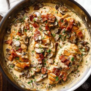 Creamy Mushroom Chicken Recipe 16 Creamy mushroom chicken cooked in a skillet with bacon and garlic cream sauce
